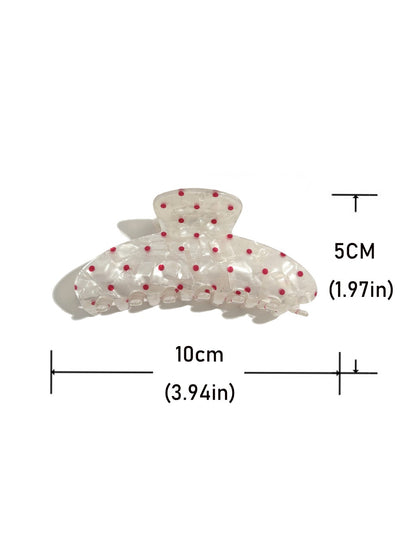 Beau polka dot updo claw clip securing thick brown hair from the back