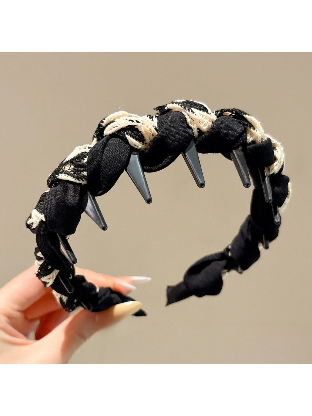 Side view of Gifty wave shape headband highlighting fabric folds and shape