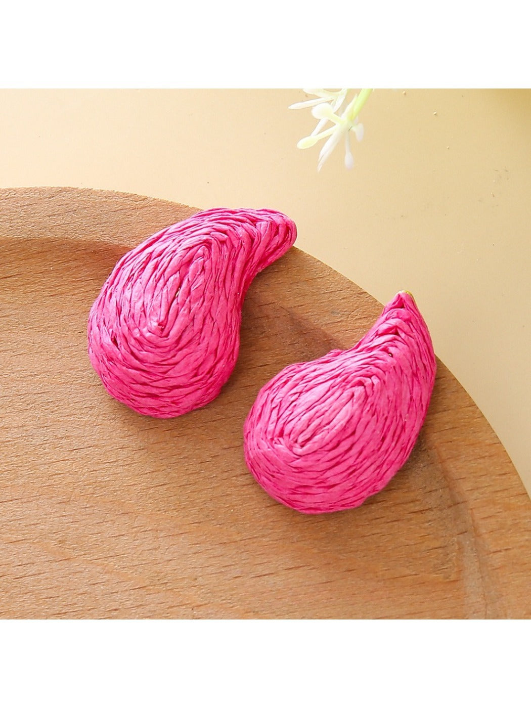 Earedge raffia water drop shaped stud earrings in a jewelry box