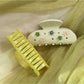 Side view of Beau floral crescent hair claw clip highlighting curved shape