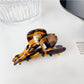 Beau floral hair claw clip shown from back to display clasp mechanism