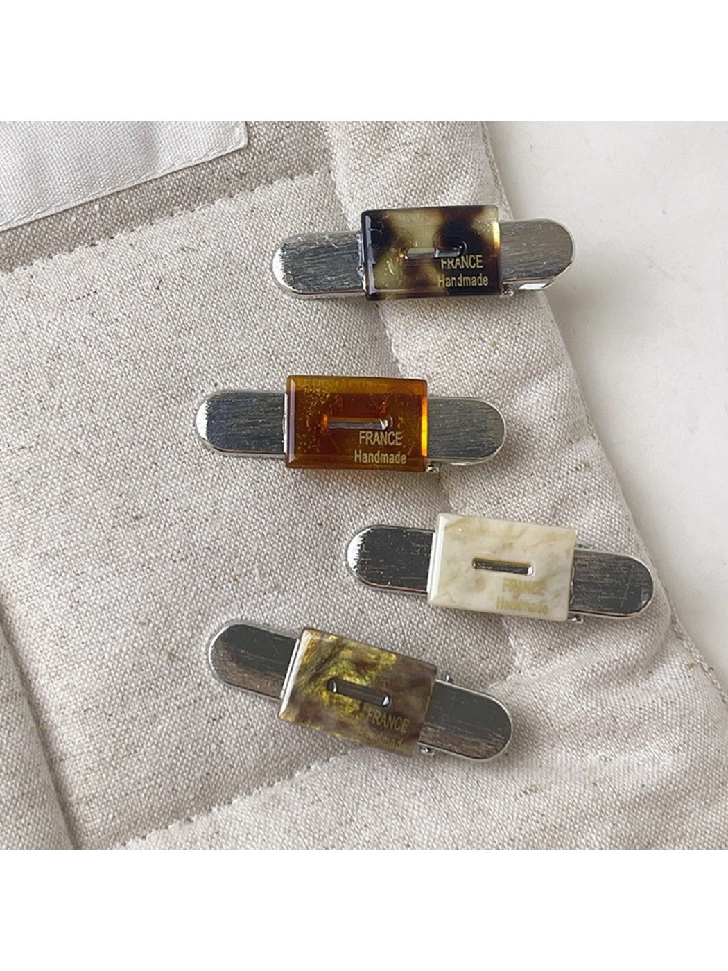 Beau vintage flat hair clip open, displaying metal clasp mechanism