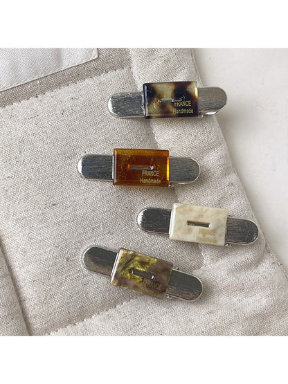 Beau vintage flat hair clip open, displaying metal clasp mechanism