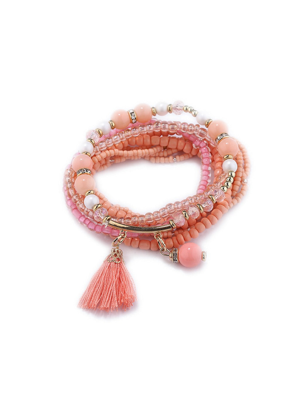 Lovra multi-row beaded bracelet styled with other jewelry on a wooden table