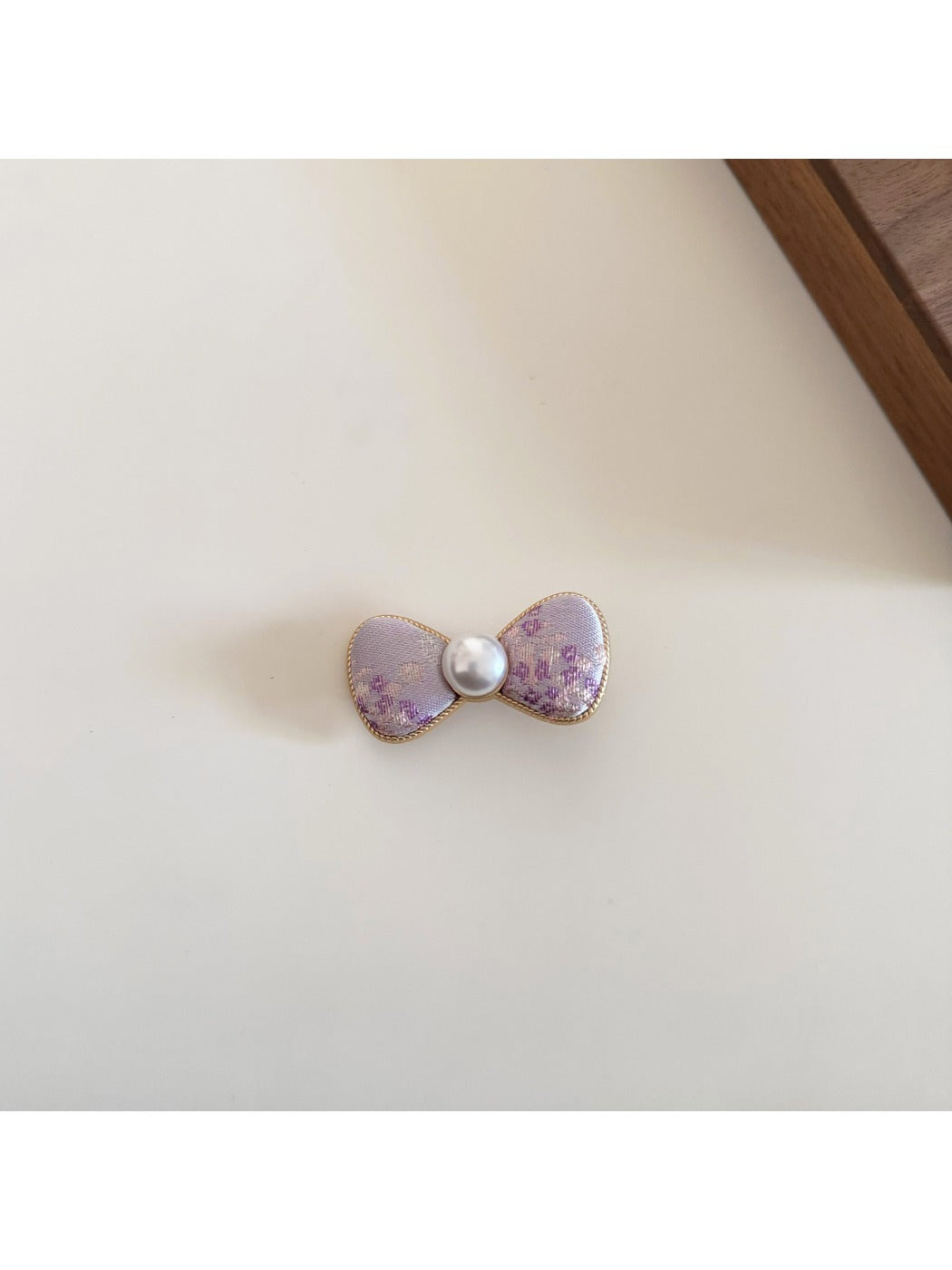 Beau bow hair clip displayed on a white background from above