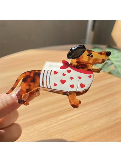 Beau dachshund claw clip placed on wooden surface with natural lighting