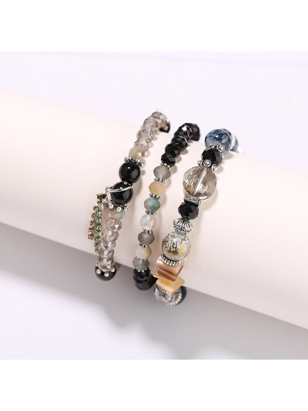 Lovra elegant beaded bracelet styled with matching jewelry on model's arm