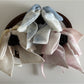Close-up of Beau bow ribbon streamer claw clip showing detailed ribbon texture