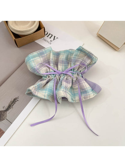 Side view of plaid scrunchie headband showing fabric texture