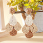 Model wearing Earedge chic color block raffia drop earrings with casual outfit