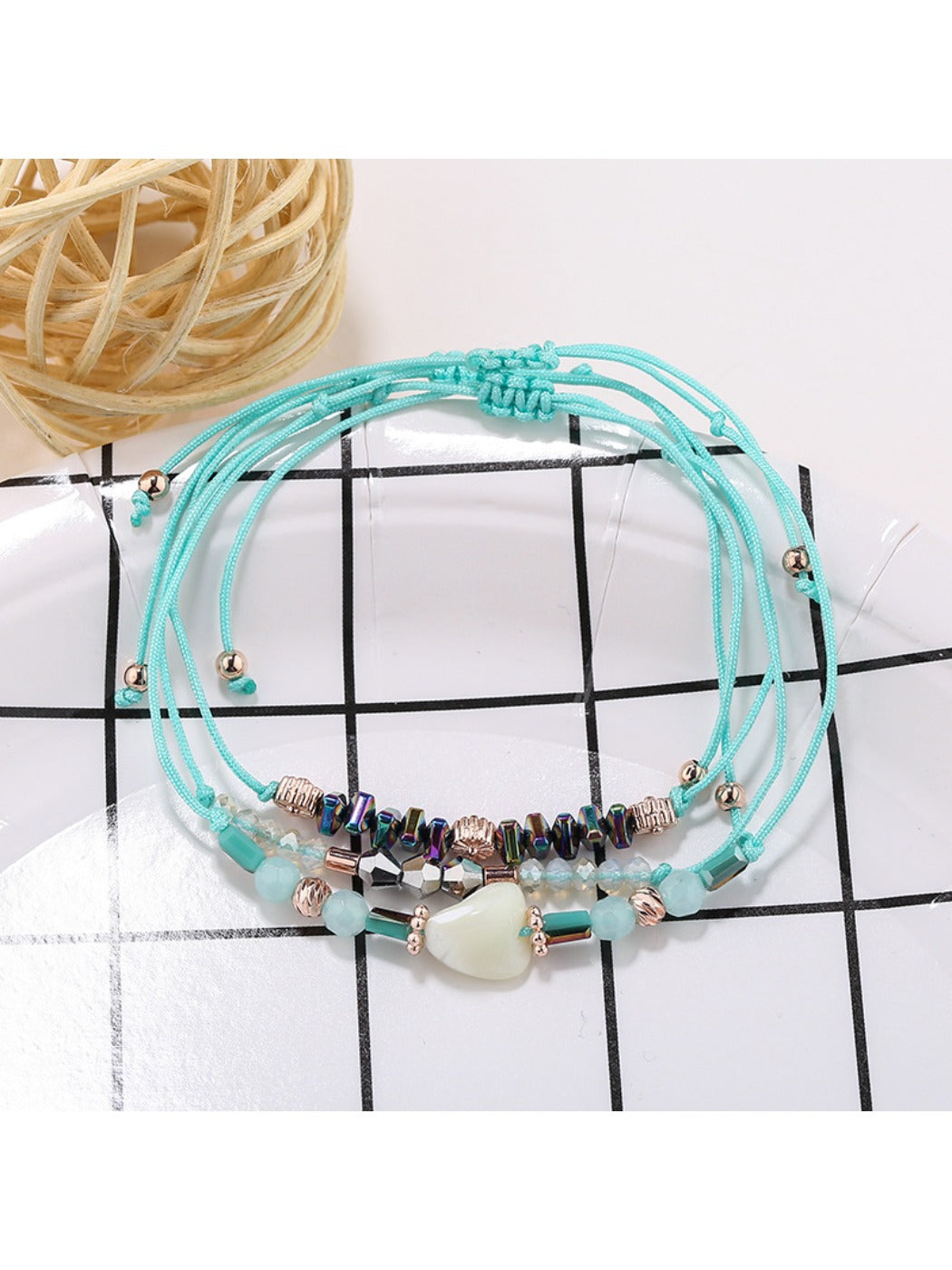 Lovra beaded woven cord bracelet worn with casual outfit on wrist