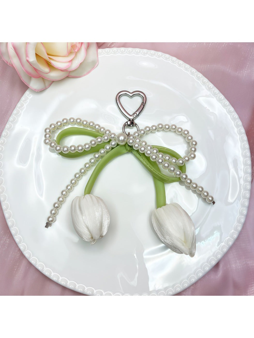 Keychain attached to a set of keys highlighting the pendant design