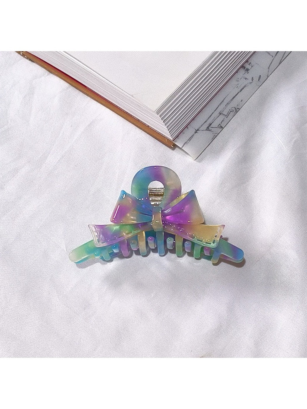 Top view of Beau acetate bow shaped claw clip showing bow shape details