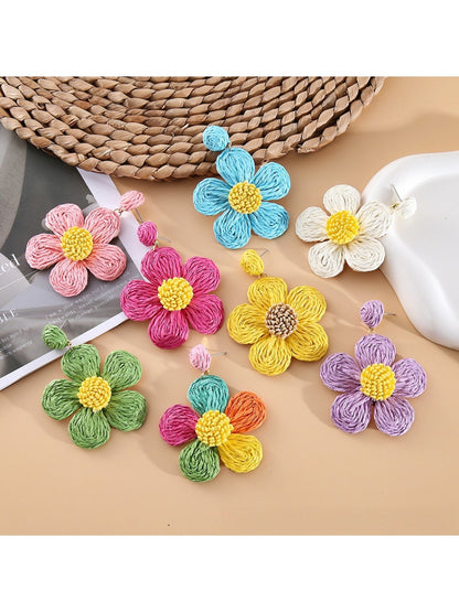 Close-up of Earedge minimalist flower shaped drop earrings on white background