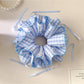Side view of blue plaid double layer hair scrunchie showing fabric texture