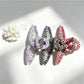 Side view of Beau colorful plaid fabric wrapped claw clip