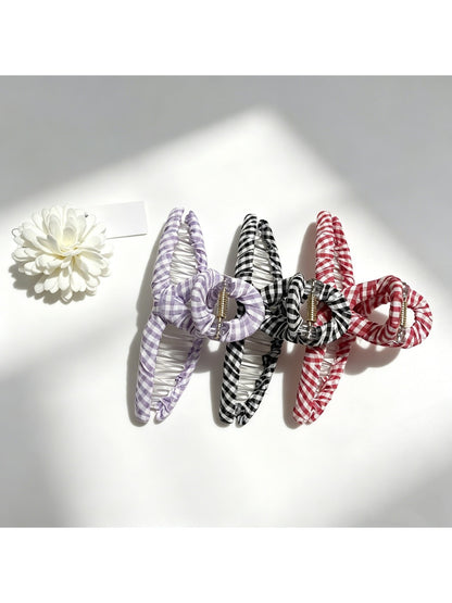 Side view of Beau colorful plaid fabric wrapped claw clip