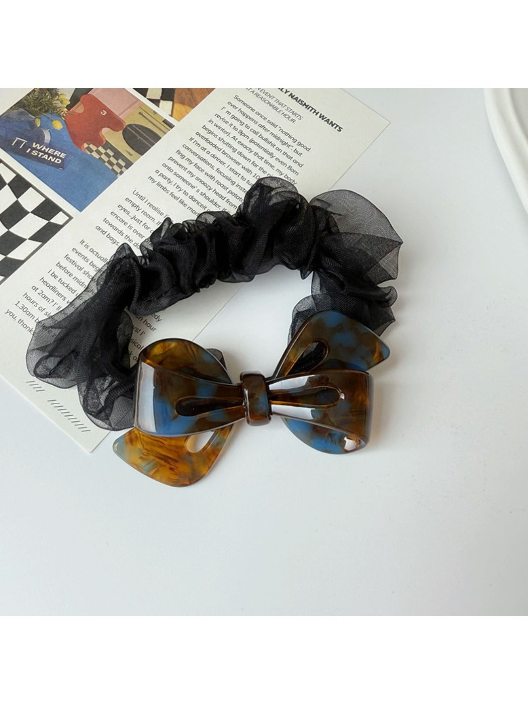 Top view of Gifty mesh bow acetate scrunchie highlighting texture and design