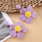 Detailed shot of Earedge minimalist flower drop earrings highlighting craftsmanship
