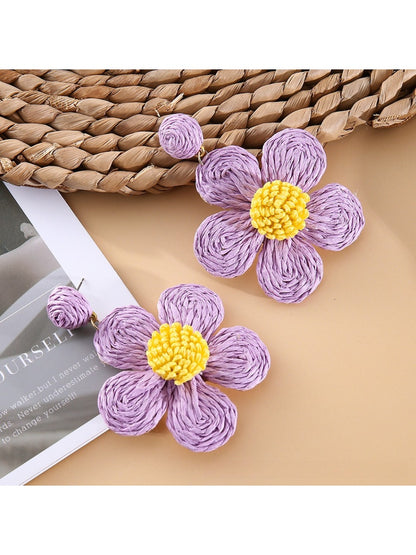 Detailed shot of Earedge minimalist flower drop earrings highlighting craftsmanship