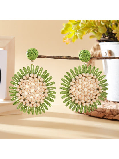 Pair of gold sunflower shaped drop earrings arranged with green leaves