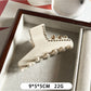 Beau rhinestone embellished claw clip displayed on a textured surface
