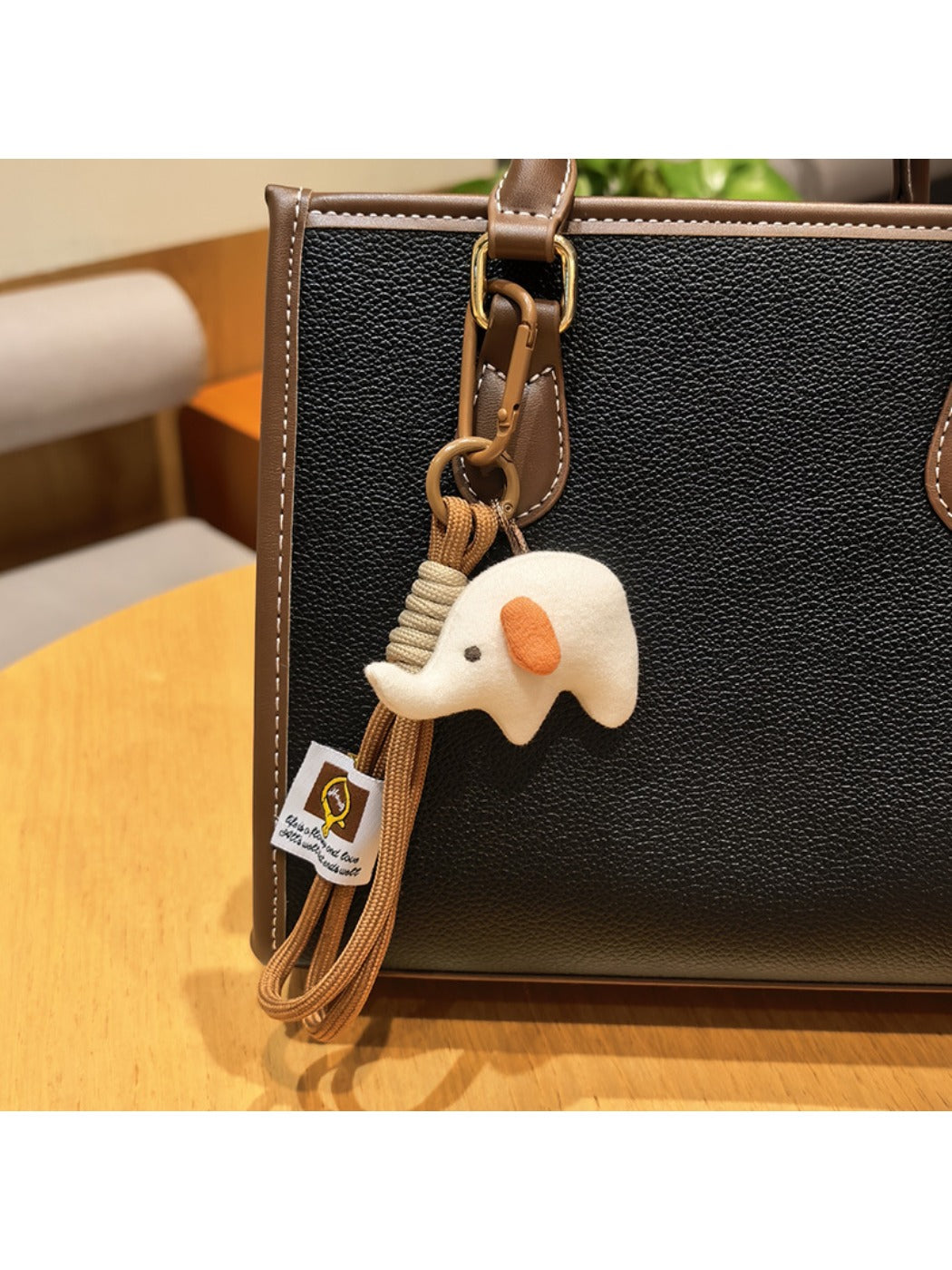 Elephant charm keychain alongside other animal-themed keychains