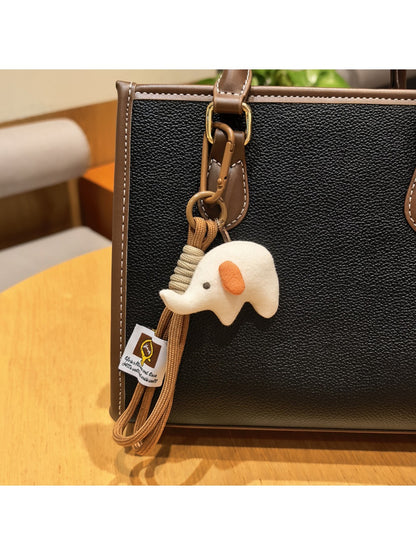 Elephant charm keychain alongside other animal-themed keychains