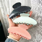 Close-up of Beau polka dot acetate claw clip highlighting pattern and texture