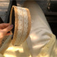 Soft straw woven lace headband styled with loose hair on female model