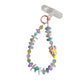 Keypus beaded phone strap keychain attached to a smartphone on a wooden surface