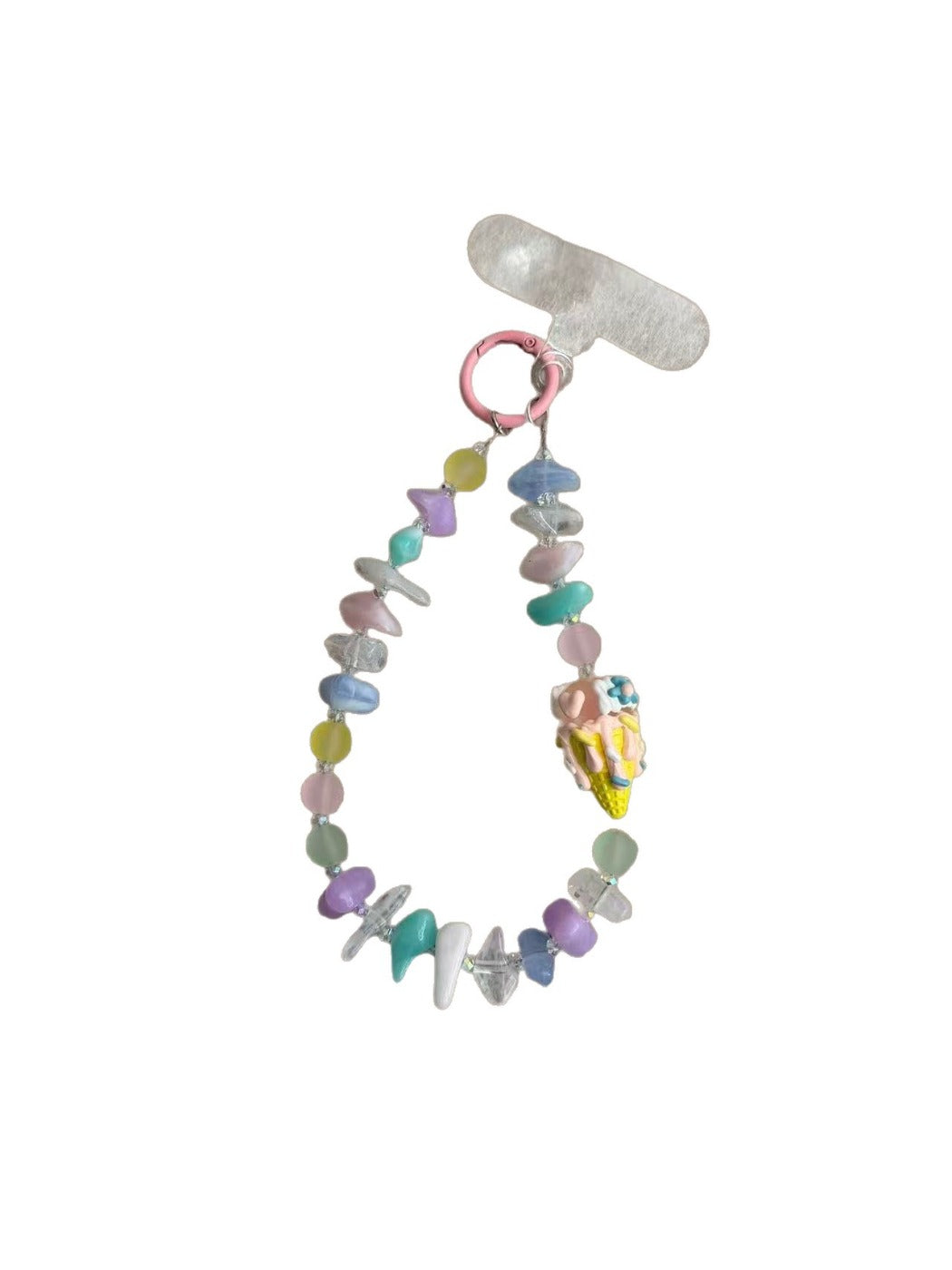 Keypus beaded phone strap keychain attached to a smartphone on a wooden surface