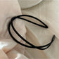 Gifty acrylic headband worn on model with short hair, showcasing fit and style