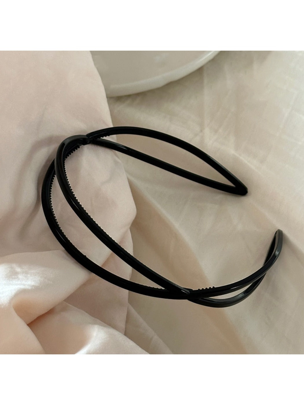 Gifty acrylic headband worn on model with short hair, showcasing fit and style