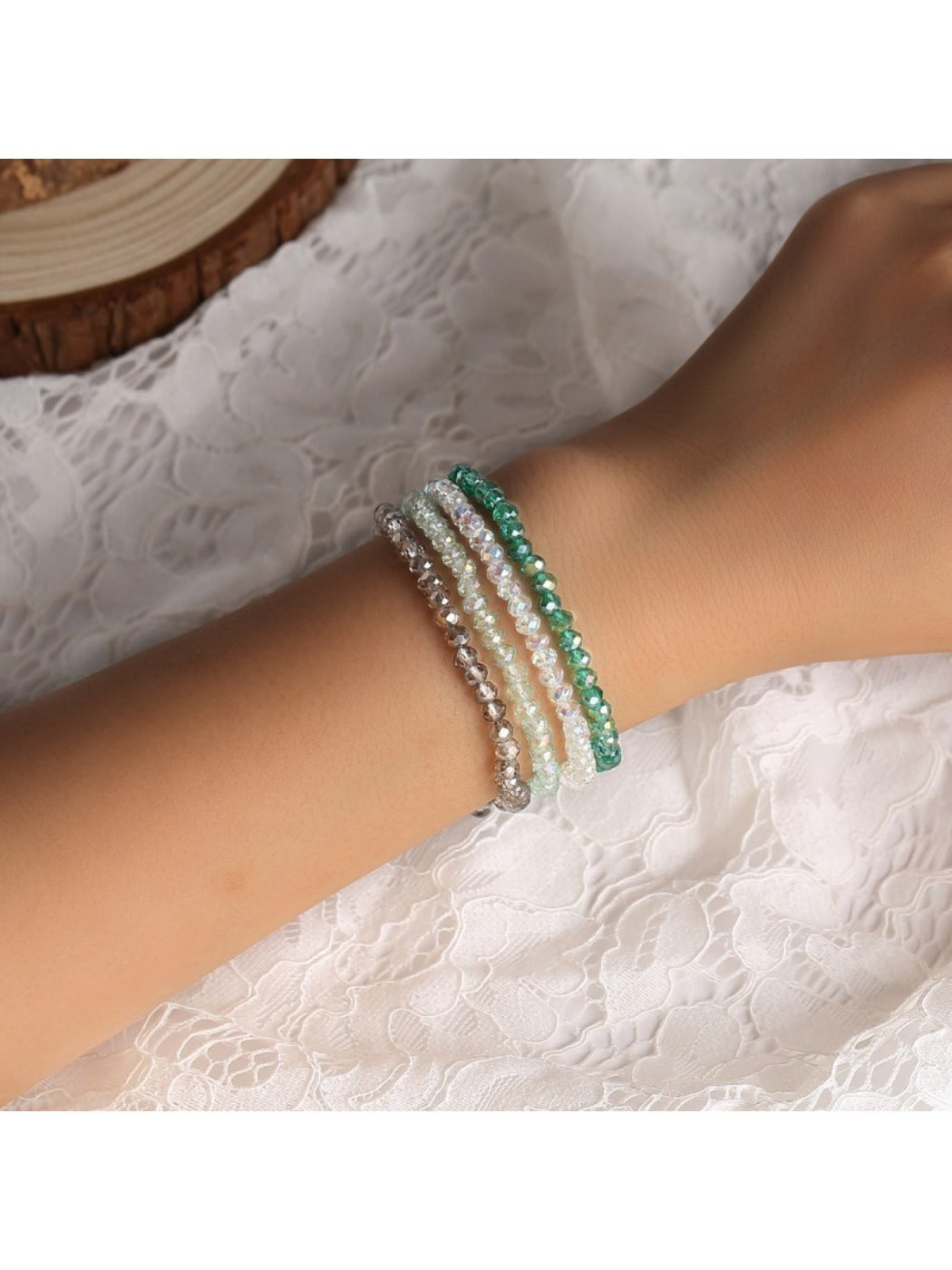 Lovra Bohemian multi strand bracelet with colorful beads and gold accents on a white background