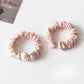 Top view of the strawberry hair tie highlighting the detailed fruit decoration