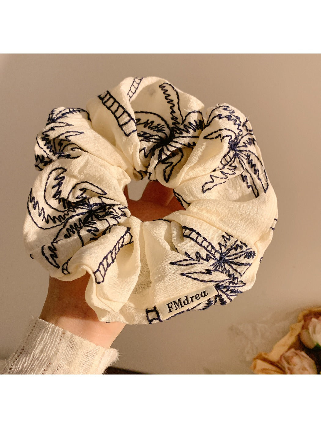 Vintage style scrunchie with coconut tree print on beige fabric