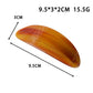 Beau ponytail hair clip holding a section of dark hair in an oval shape