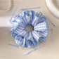 Close-up of blue plaid fabric and elastic band of the double layer scrunchie
