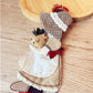 Keypus fabric patchwork keychain hanging from a bag zipper, showing practical use