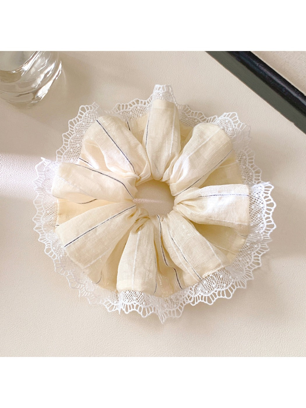 Side view of Gifty elegant scrunchie showing striped pattern and texture