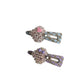 Side view of plaid beaded heart hair clip displaying clip mechanism