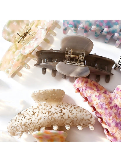 Close-up of Beau tiny floral acetate claw clip showing floral pattern and clasp
