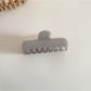 Beau hair clip in pastel yellow with rectangular shape and glossy finish