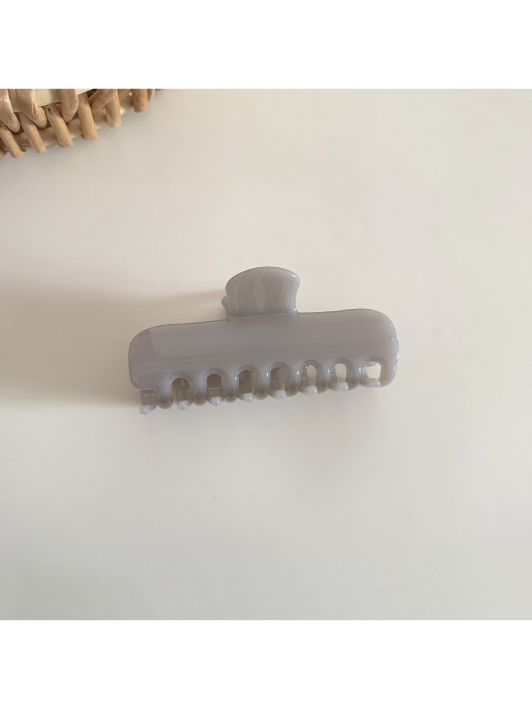 Beau hair clip in pastel yellow with rectangular shape and glossy finish