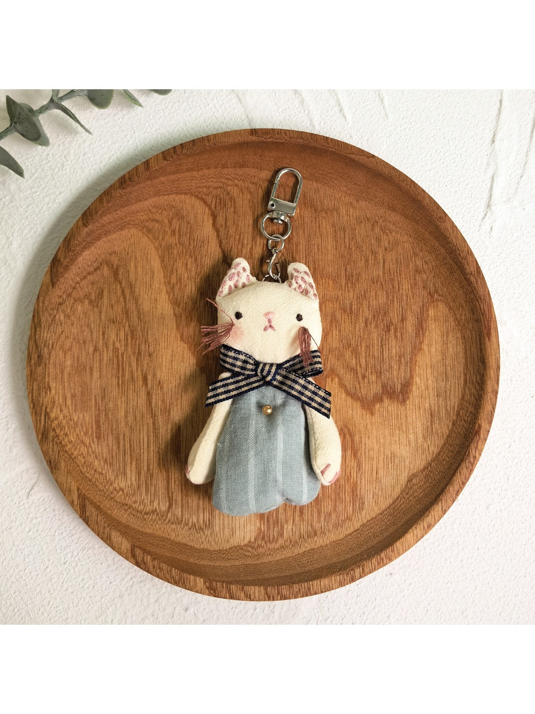 Keypus classic cat charm keychain shown with a leather key holder