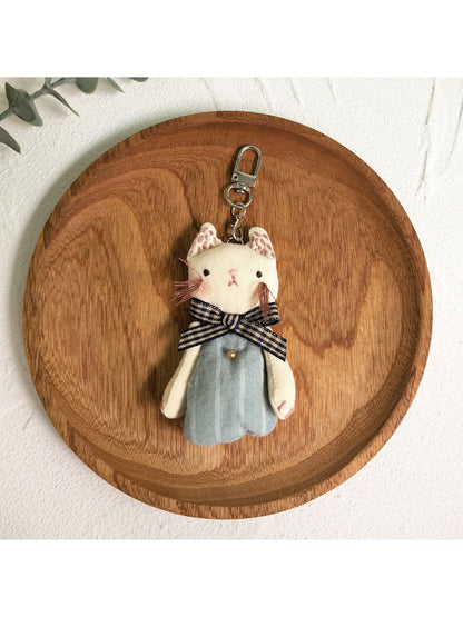 Keypus classic cat charm keychain shown with a leather key holder
