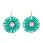 Model wearing Earedge raffia woven flower-shaped earrings with casual outfit