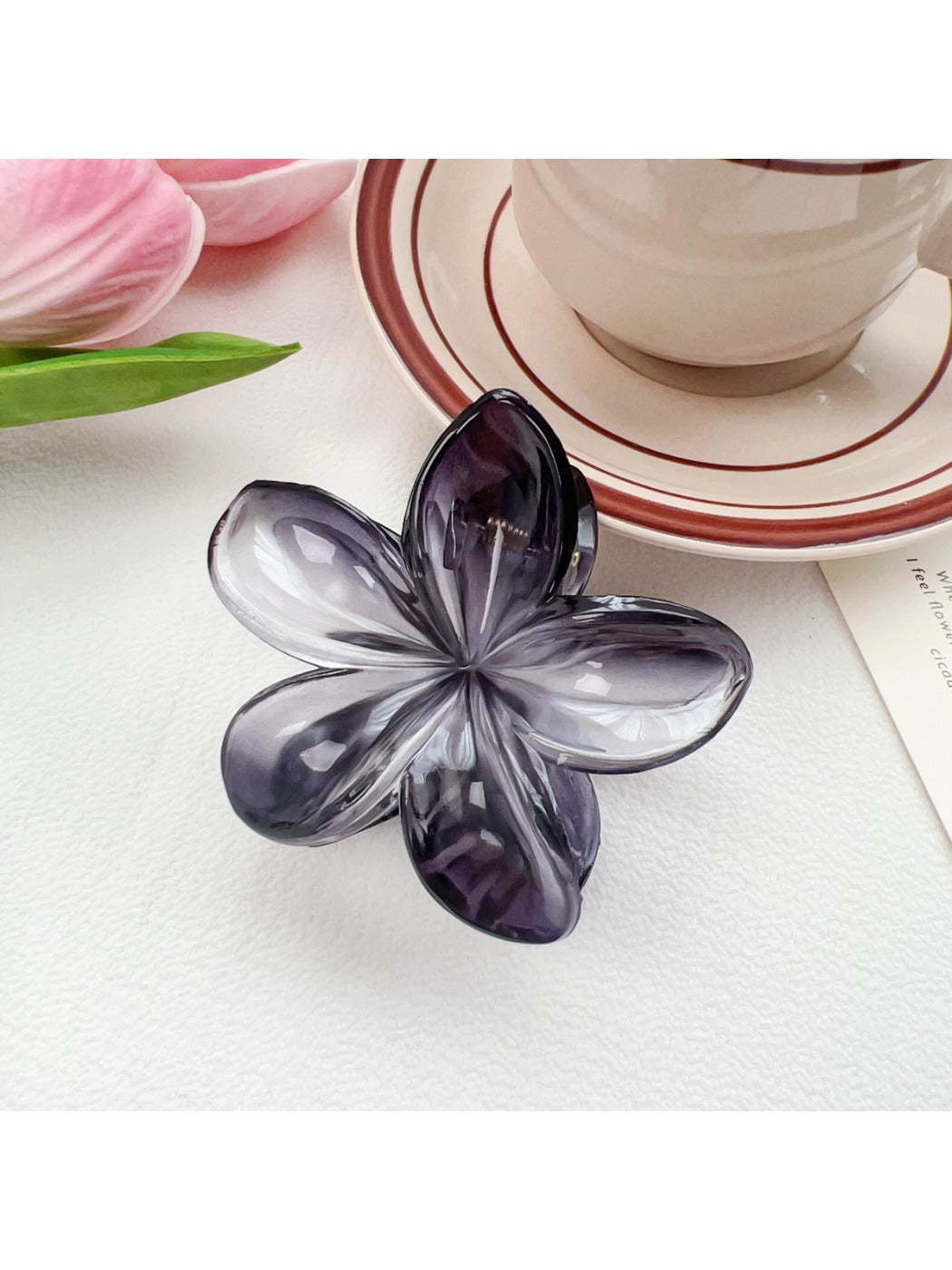 Beau classic flower claw clip with bright pink, yellow, and green colors on white background