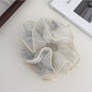 Gifty scrunchie packaged in a minimalist box, ready for gifting